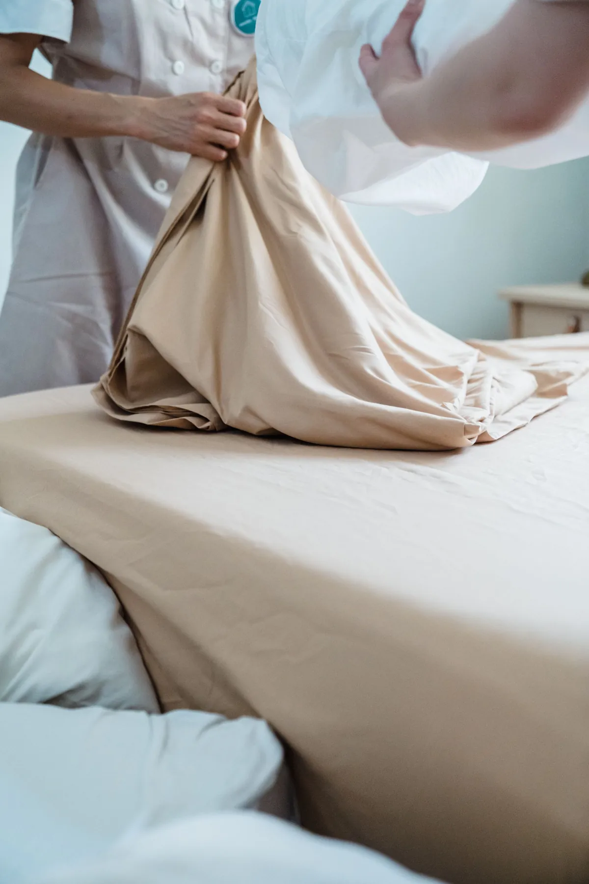 Making a bed with fresh linen
